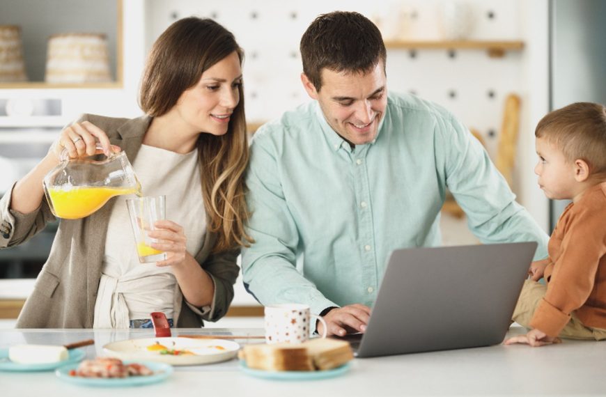 Smiling family relaxing together inside their home