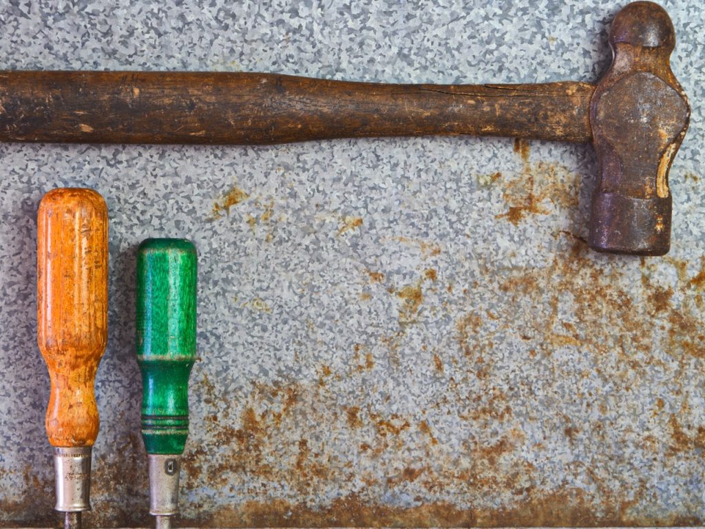 A set of hand tools laid out on a work surface