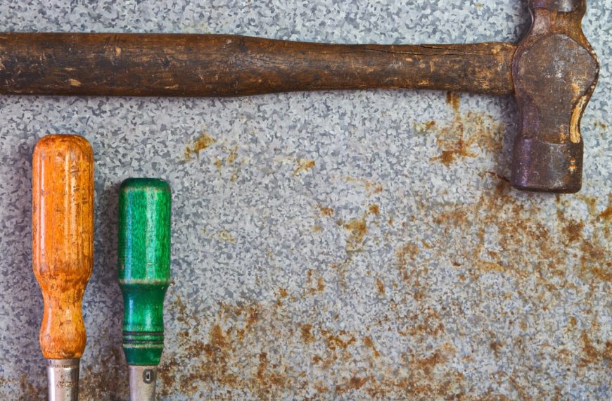 A set of hand tools laid out on a work surface