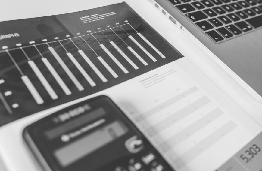 Calculator with numbers on a desk, used to work out costs and savings